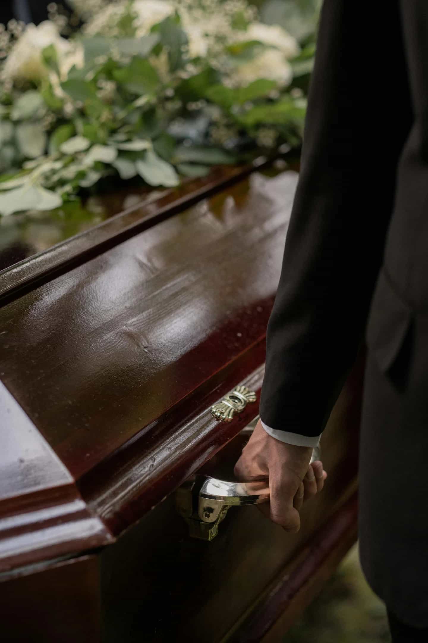 Person carrying a coffin
