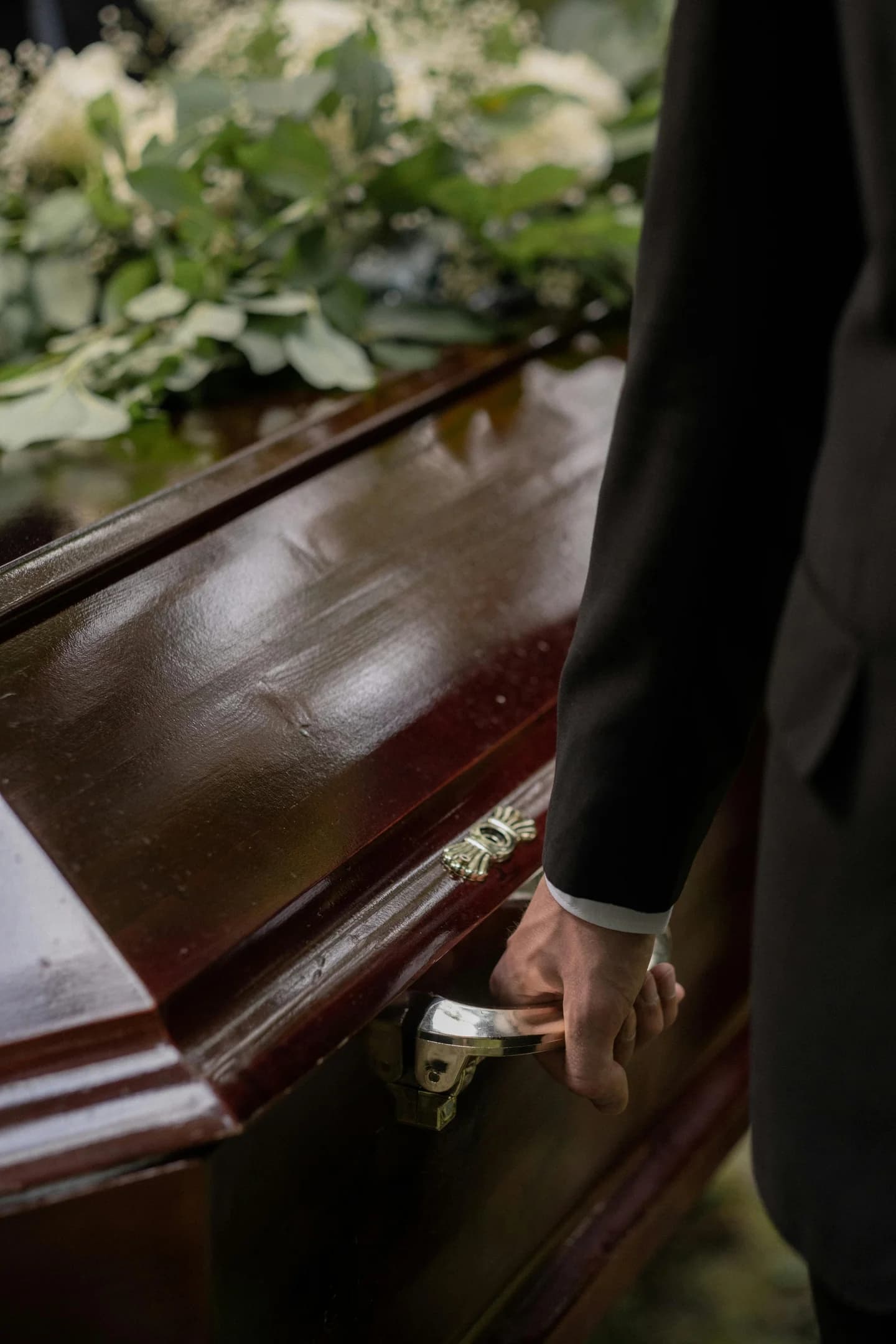 Person carrying a coffin